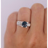 14K White Gold 1.56 Carat Oval Blue Sapphire and Invisible Cluster Diamond Ring