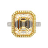 Emerald Cut Natural 7.25 Carat Fancy Light Yellow Diamond with Round Diamond Halo Ring