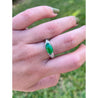 GIA certified Oval Jade with Diamond Sidestones in Platinum Ring