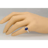 Oval cut Natural Blue Sapphire with natural baguette cut diamonds in 18k solid white gold